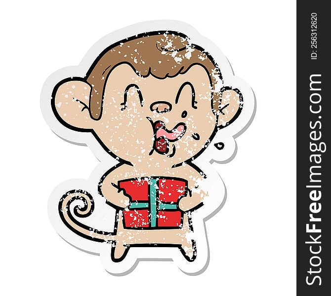 distressed sticker of a crazy cartoon monkey with christmas present