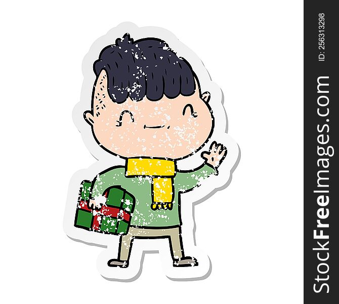 Distressed Sticker Of A Cartoon Friendly Boy With Christmas Present
