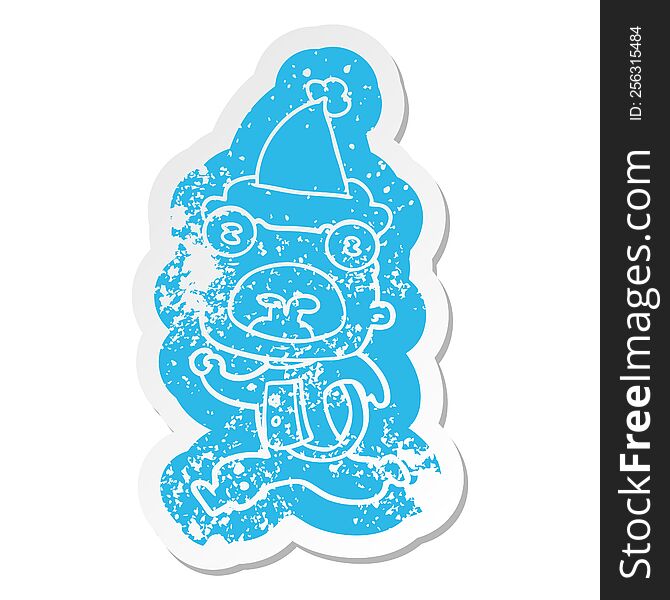 quirky cartoon distressed sticker of a weird alien running away wearing santa hat