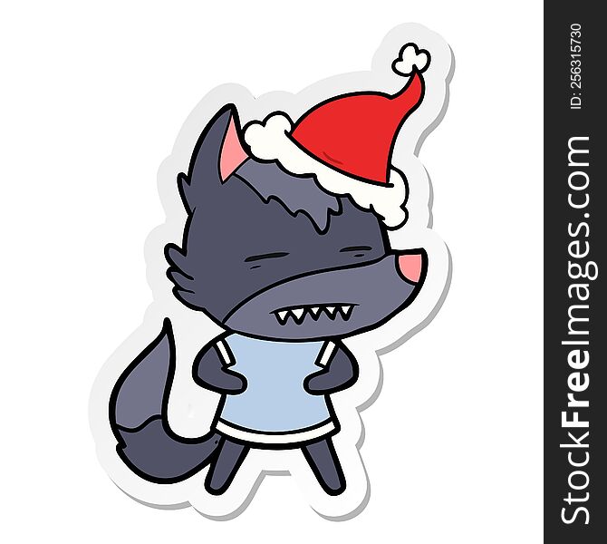 Sticker Cartoon Of A Wolf Showing Teeth Wearing Santa Hat