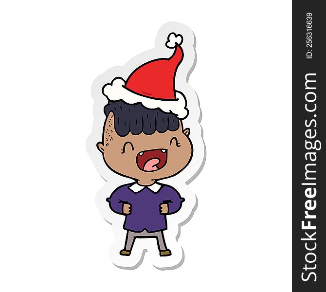 hand drawn sticker cartoon of a happy boy laughing wearing santa hat