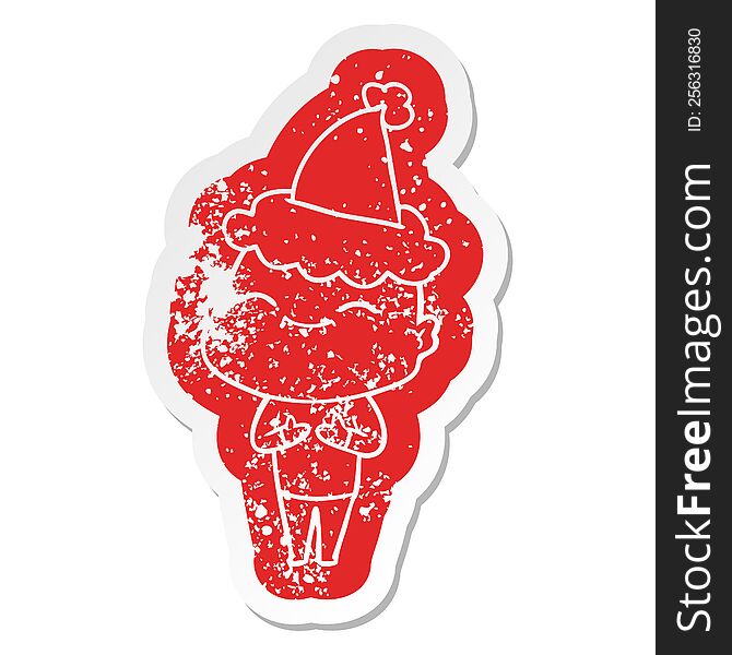 happy quirky cartoon distressed sticker of a bald man wearing santa hat