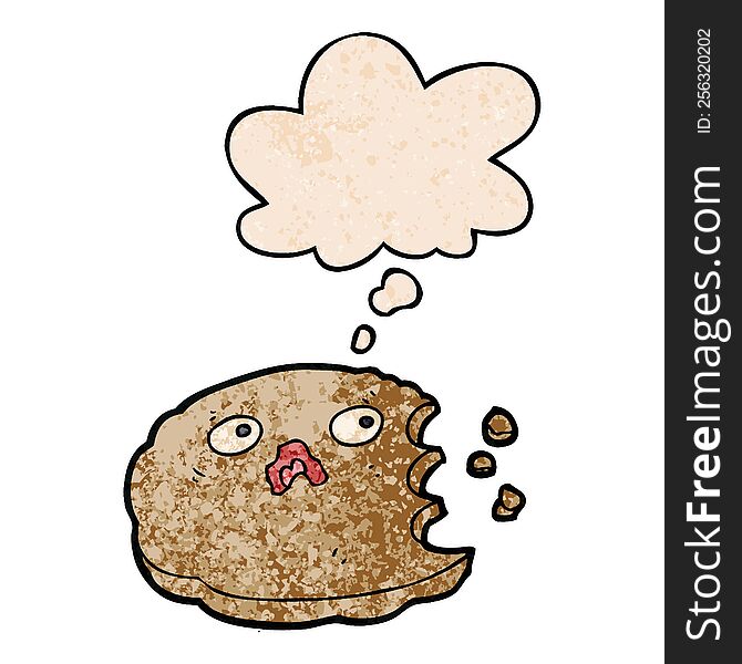 cartoon bitten cookie with thought bubble in grunge texture style. cartoon bitten cookie with thought bubble in grunge texture style