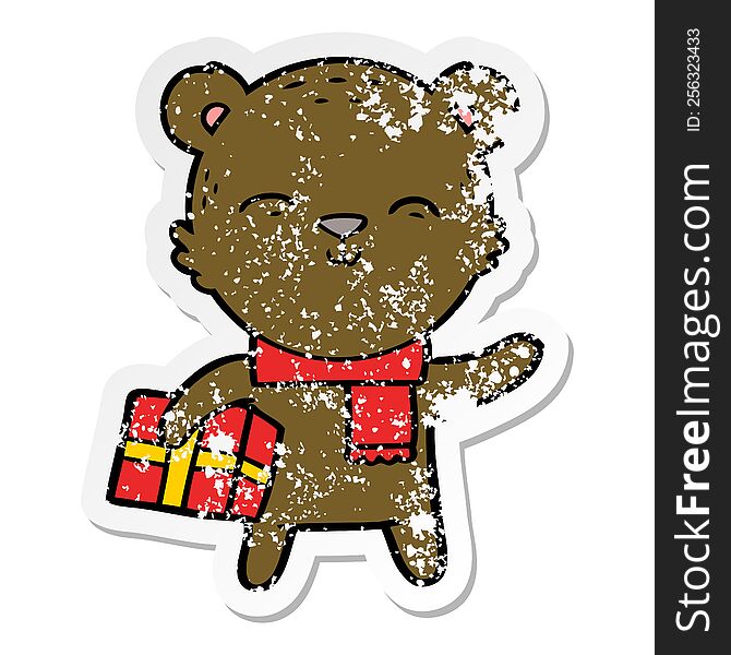 Distressed Sticker Of A Happy Cartoon Bear With Present