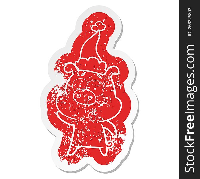 Happy Cartoon Distressed Sticker Of A Pig Wearing Santa Hat