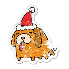 Christmas Distressed Sticker Cartoon Of Kawaii Dog Stock Photo