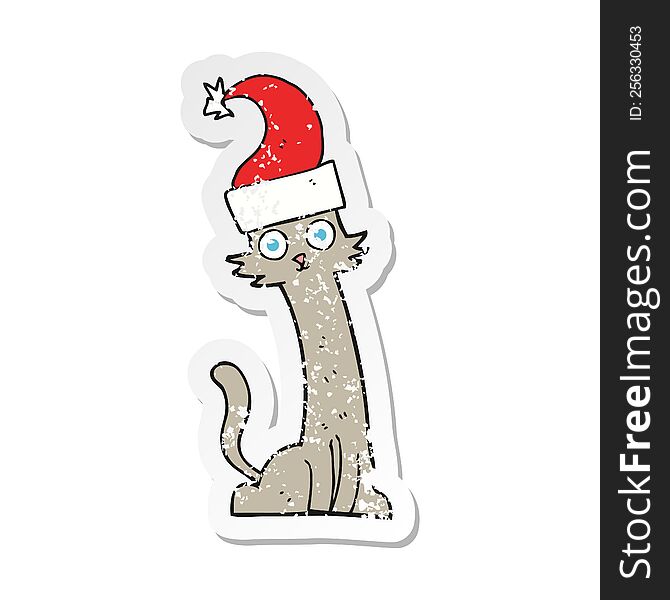 Retro Distressed Sticker Of A Cartoon Cat In Christmas Hat