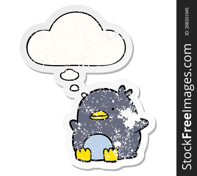cute cartoon penguin with thought bubble as a distressed worn sticker