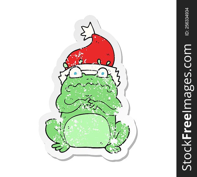 Retro Distressed Sticker Of A Cartoon Frog In Christmas Hat