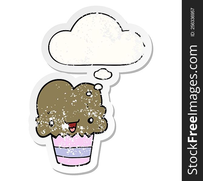 Cartoon Cupcake With Face And Thought Bubble As A Distressed Worn Sticker