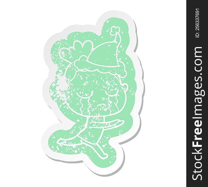 Cartoon Distressed Sticker Of A Crying Woman Wearing Santa Hat