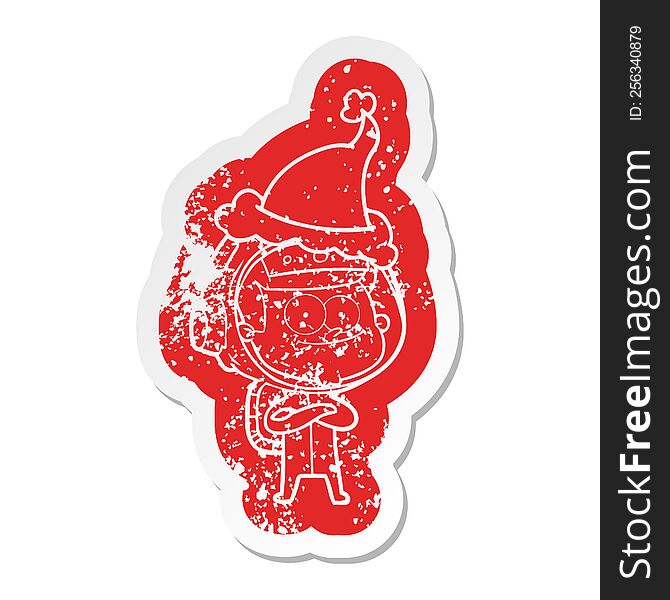Happy Astronaut Cartoon Distressed Sticker Of A Wearing Santa Hat
