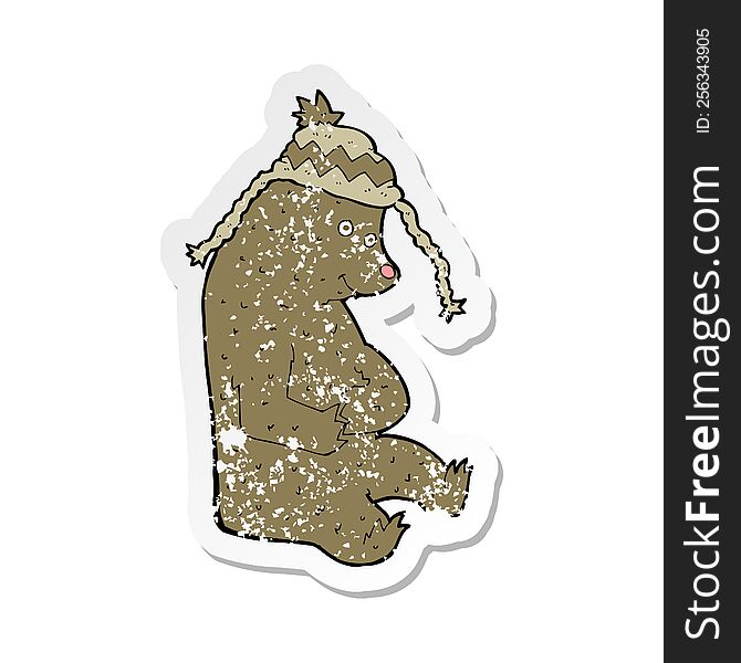 retro distressed sticker of a cartoon bear in winter hat
