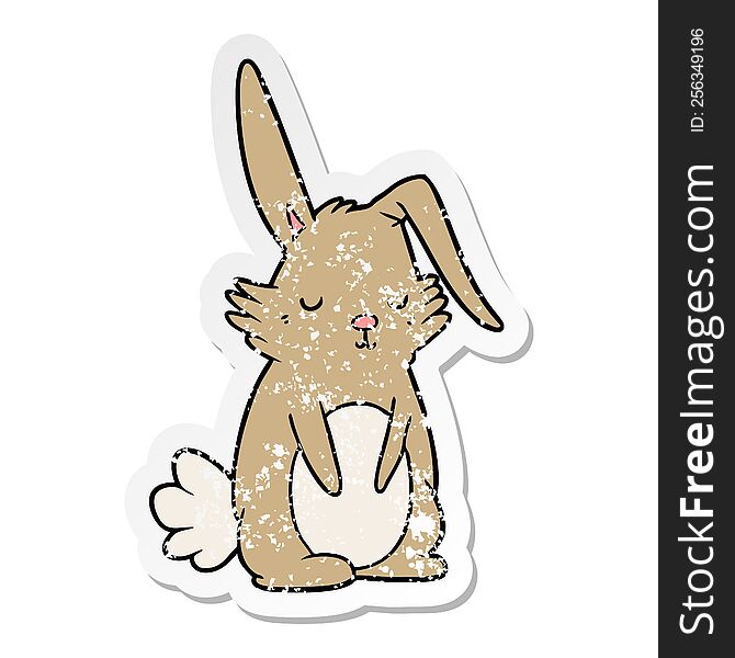 distressed sticker of a cartoon sleepy rabbit