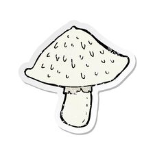 Retro Distressed Sticker Of A Cartoon Wild Mushroom Stock Photography