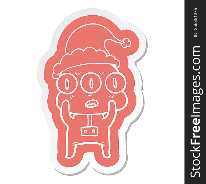 quirky cartoon  sticker of a three eyed alien wearing santa hat