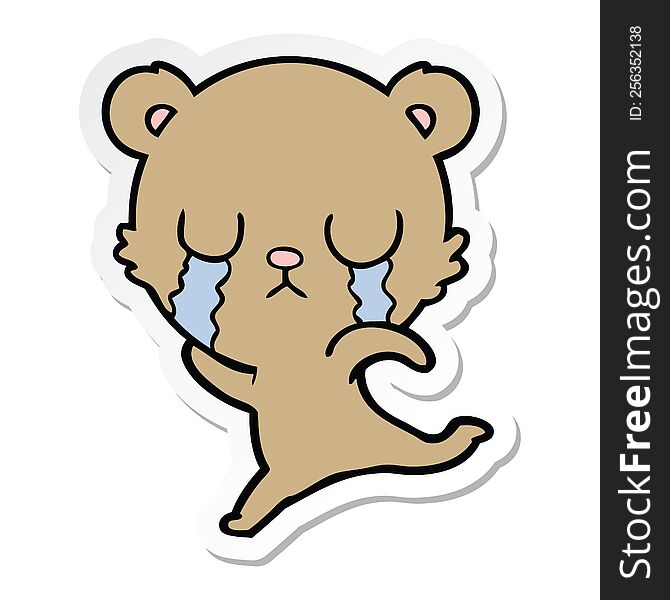 sticker of a crying cartoon bear running away
