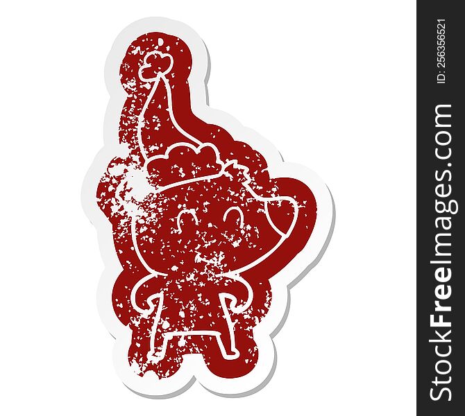 female bear quirky cartoon distressed sticker of a wearing santa hat