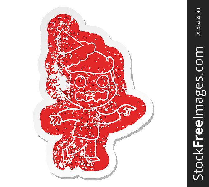 quirky cartoon distressed sticker of a stressed out pointing wearing santa hat