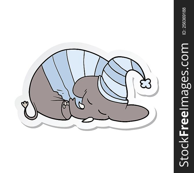 sticker of a cartoon sleeping elephant in pajamas