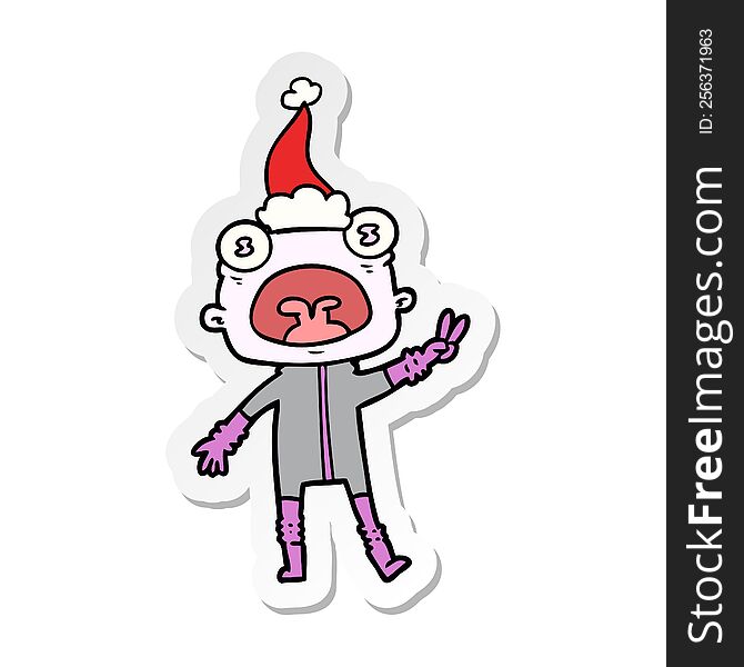 Sticker Cartoon Of A Weird Alien Waving Wearing Santa Hat