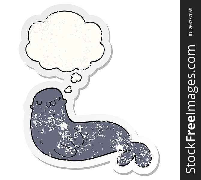 cute cartoon seal with thought bubble as a distressed worn sticker