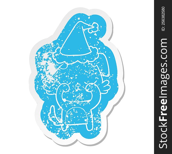 cute quirky cartoon distressed sticker of a dog wearing santa hat