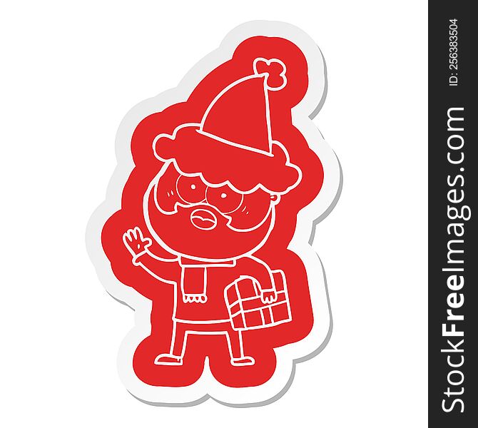 Cartoon  Sticker Of A Bearded Man With Present Wearing Santa Hat
