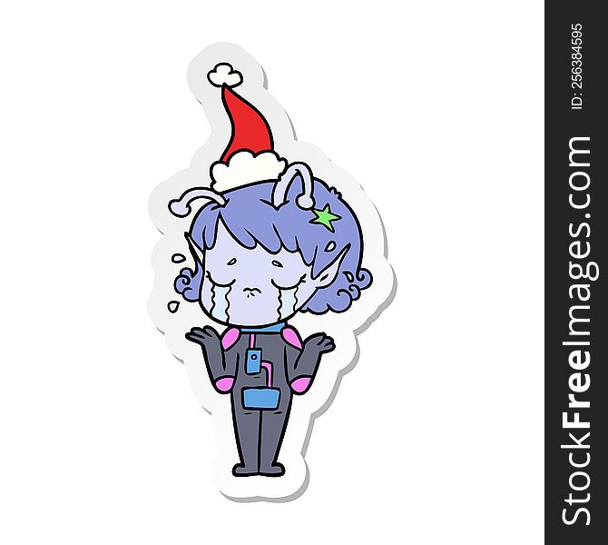 hand drawn sticker cartoon of a crying alien girl wearing santa hat