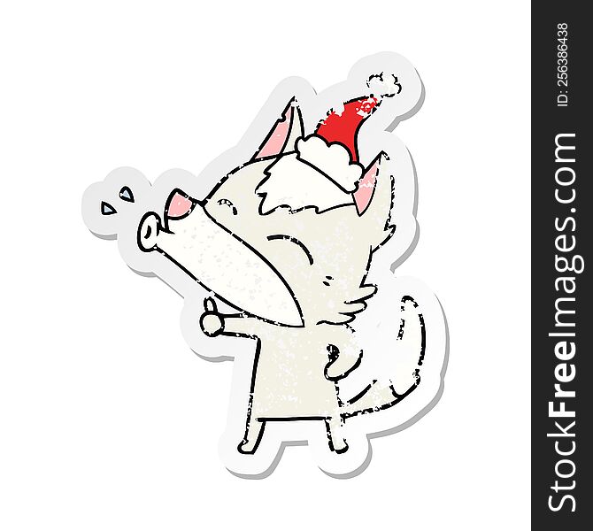 Howling Wolf Distressed Sticker Cartoon Of A Wearing Santa Hat