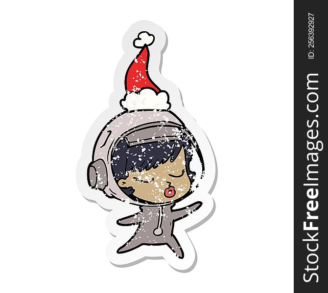 hand drawn distressed sticker cartoon of a pretty astronaut girl wearing santa hat