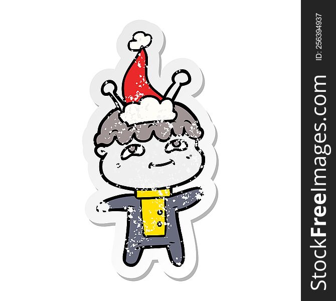 Friendly Distressed Sticker Cartoon Of A Spaceman Wearing Santa Hat
