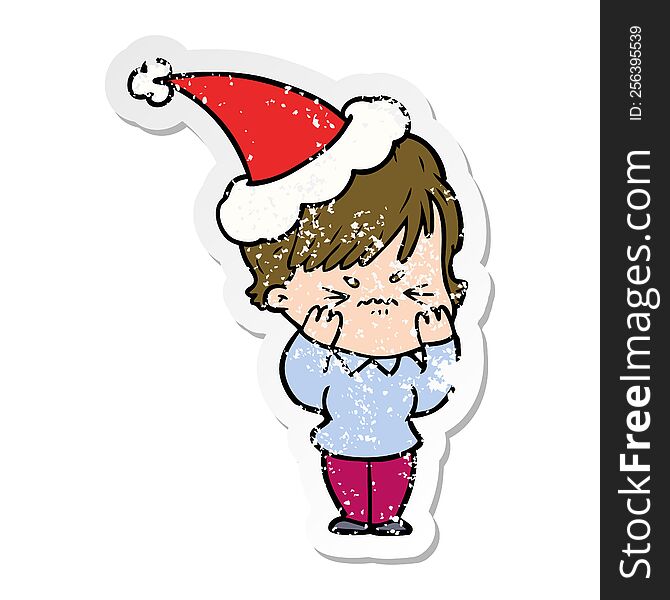 hand drawn distressed sticker cartoon of a frustrated woman wearing santa hat