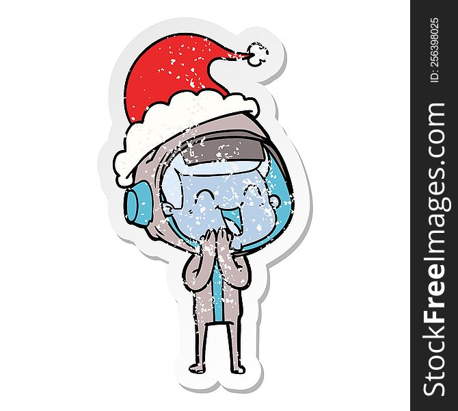 Happy Distressed Sticker Cartoon Of A Astronaut Wearing Santa Hat