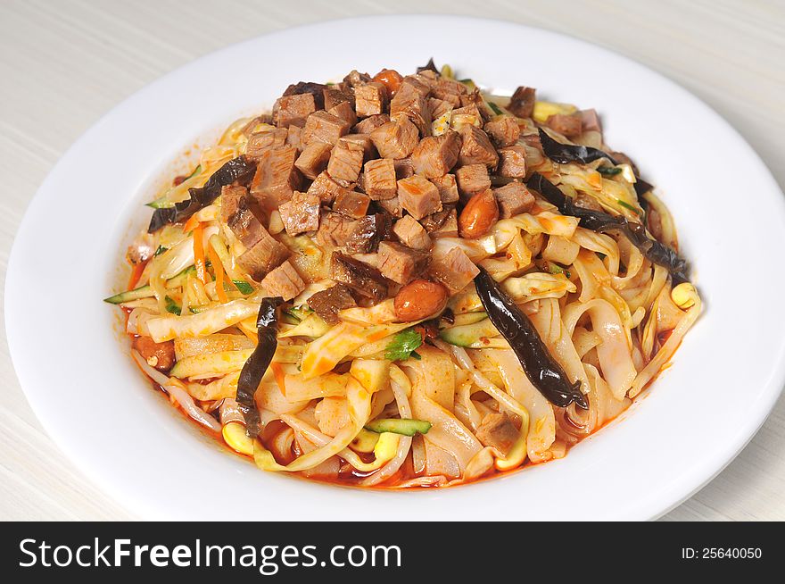 China Sichuan style noodles with pepper and minced meat. China Sichuan style noodles with pepper and minced meat