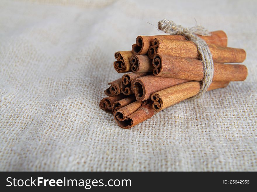 Closeup Of Cinnamon Sticks On Cotton Canvas