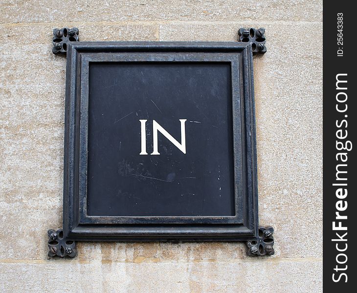 Sign indicating the entrance of a building. Sign indicating the entrance of a building
