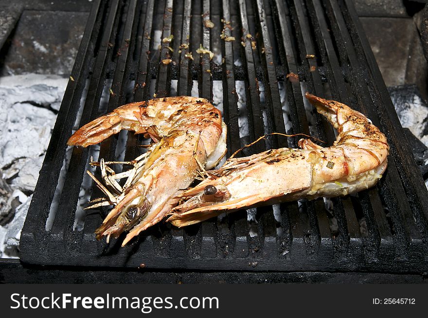 Cooking shrimp on the grill in the restaurant. Cooking shrimp on the grill in the restaurant