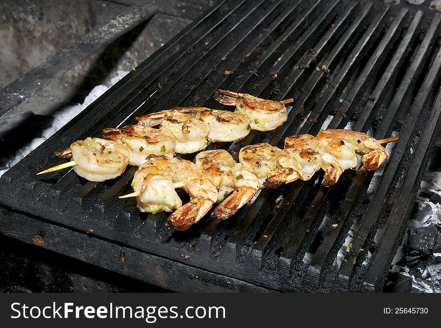 Cooking shrimp on the grill in the restaurant. Cooking shrimp on the grill in the restaurant