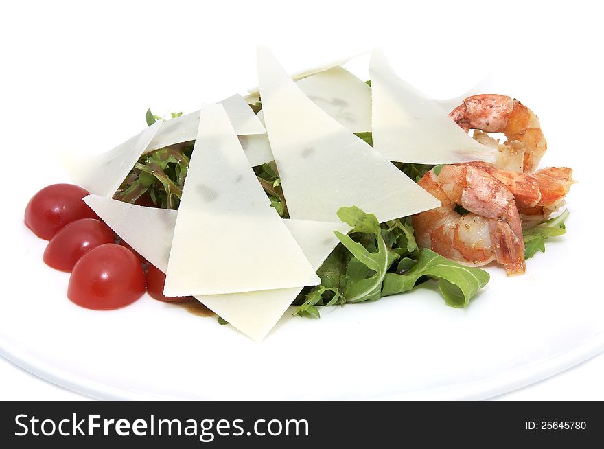 Shrimp salad and greens on a white background