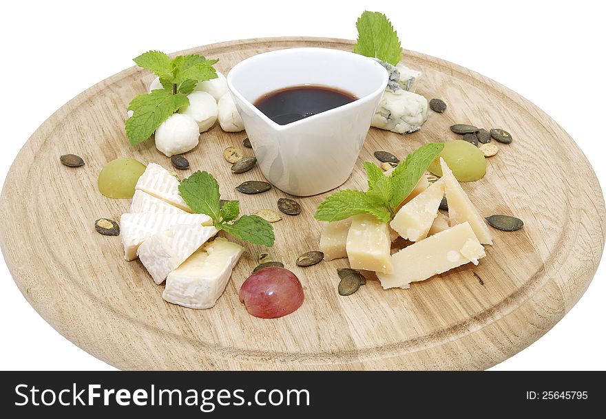 Cheese plate with a large decorated the assortment of mint