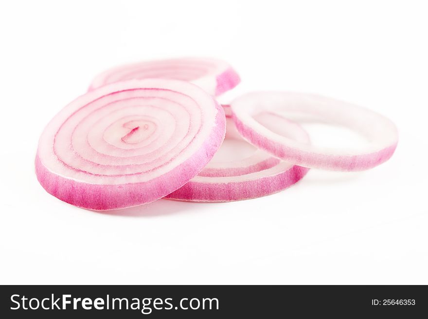 closeup of red onion slice rings isolated over white