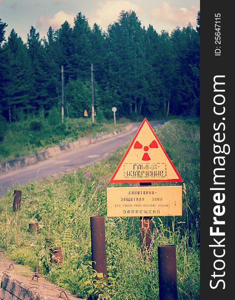 The sign of increased radiation on the outskirts of the city. The sign of increased radiation on the outskirts of the city