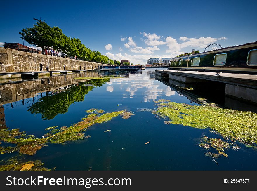 Albert dock at liverpool city centre, mooring with reflected blue sky in blue water. Albert dock at liverpool city centre, mooring with reflected blue sky in blue water