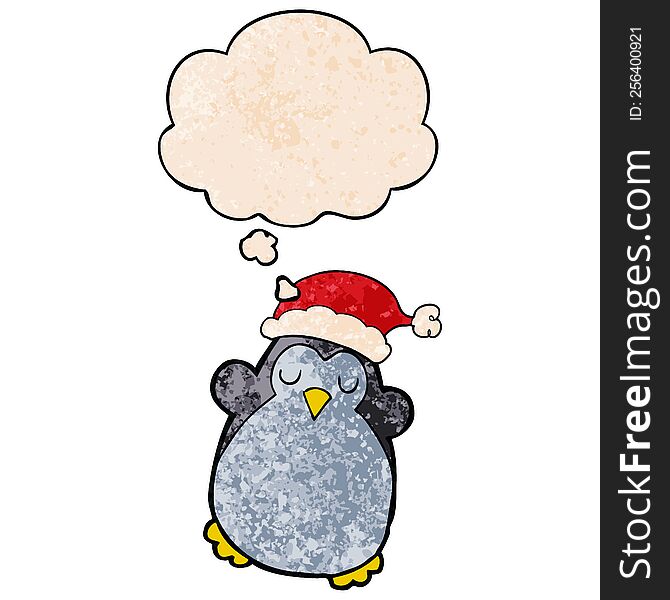 cute christmas penguin with thought bubble in grunge texture style. cute christmas penguin with thought bubble in grunge texture style
