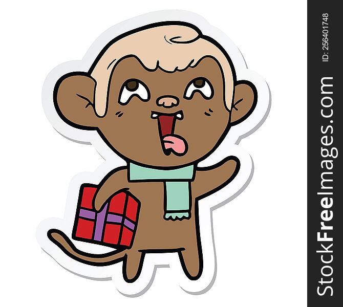 Sticker Of A Crazy Cartoon Monkey With Christmas Present