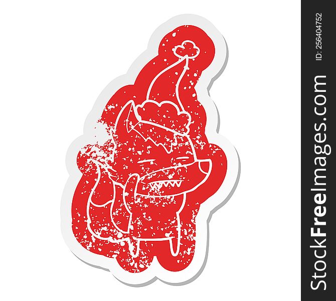 Cartoon Distressed Sticker Of A Wolf Showing Teeth Wearing Santa Hat