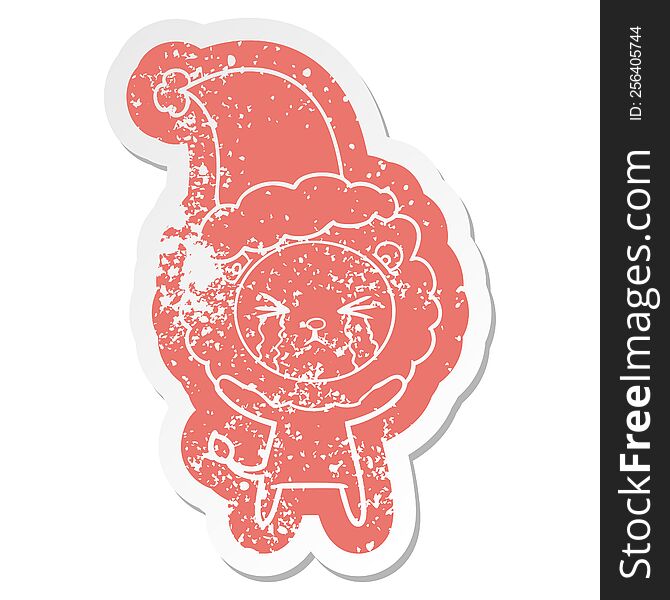 Cartoon Distressed Sticker Of A Crying Lion Wearing Santa Hat