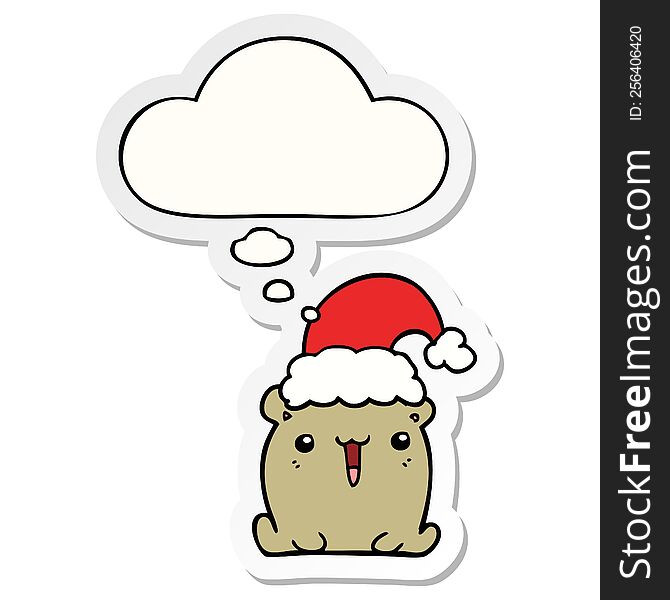 cute cartoon bear with christmas hat with thought bubble as a printed sticker