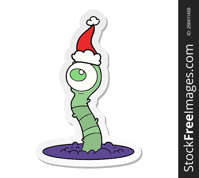 hand drawn sticker cartoon of a alien swamp monster wearing santa hat